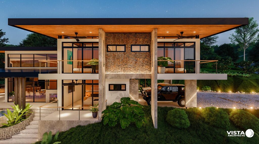 Side facade of a contemporary mountain house with warm textures, concrete walls, a firepit, and LED lighting.