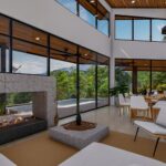 Spacious living room with modern furniture and large windows offering panoramic views